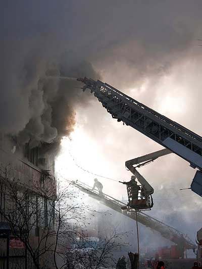 Firemen battling fire